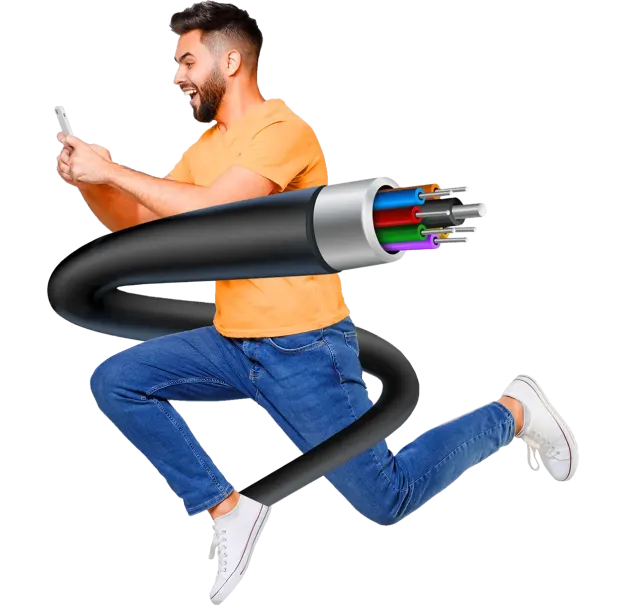 A man sorrounded by cabels and using his phone