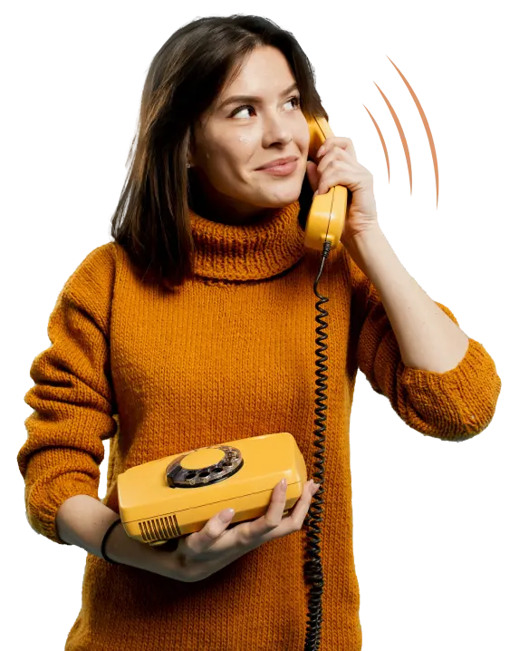 A person holding a phone and engaged in a conversation.